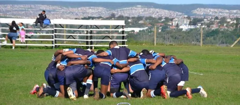 Muir College rugby team in a huddle