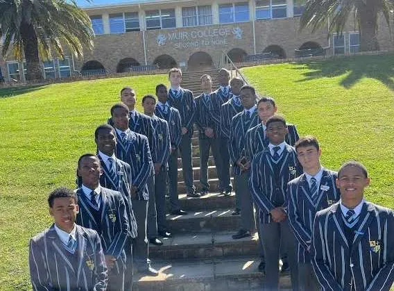 Muir College boys on the school steps